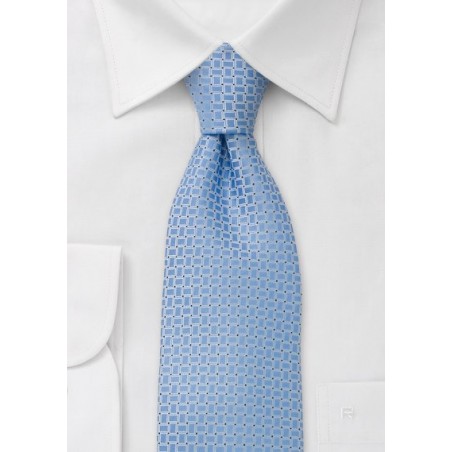 Square patterned, light blue tie