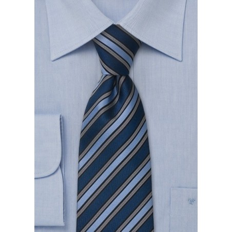 Navy blue, light blue, and gray striped silk tie