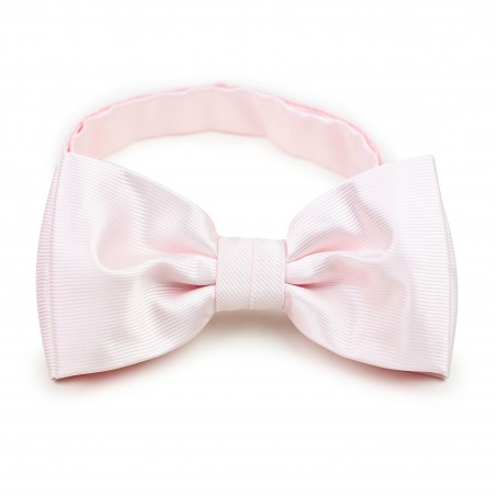 blush bow tie with ribbed texture