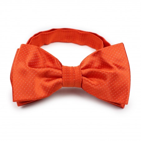 tangerine hued pin dot bow tie