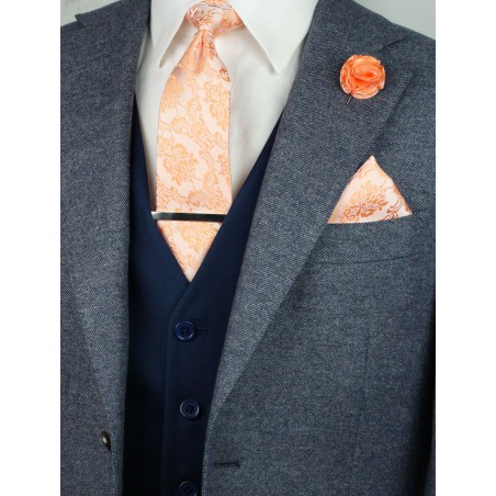 Matching peach paisley necktie and pocket square