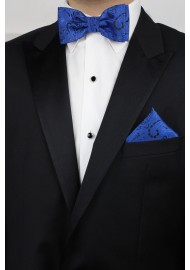 Pre-Tied Paisley Bow Tie in Royal Blue with matching pocket square styled with tux Jacket