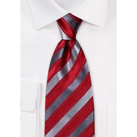 Silk tie, grey diagonal stripes on red fond